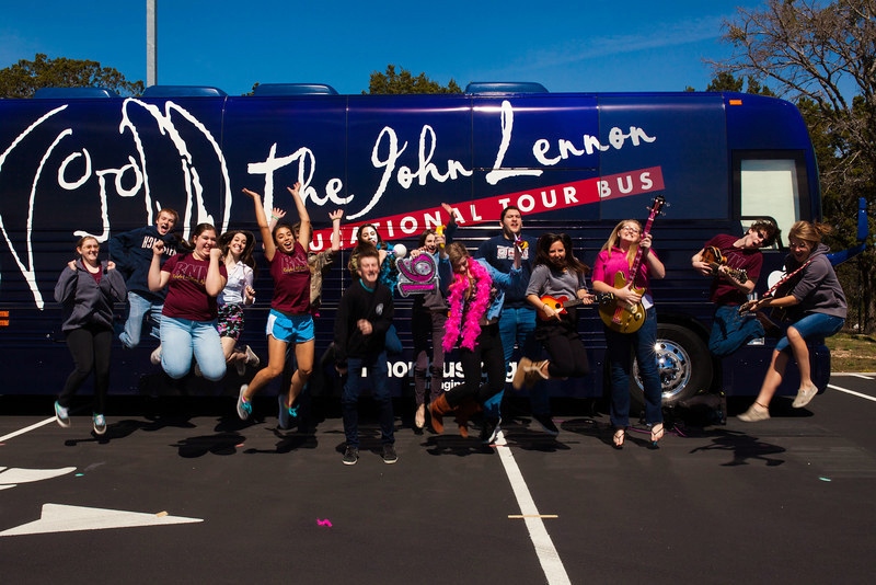 Rouse HS students celebrate at the Lennon Bus.